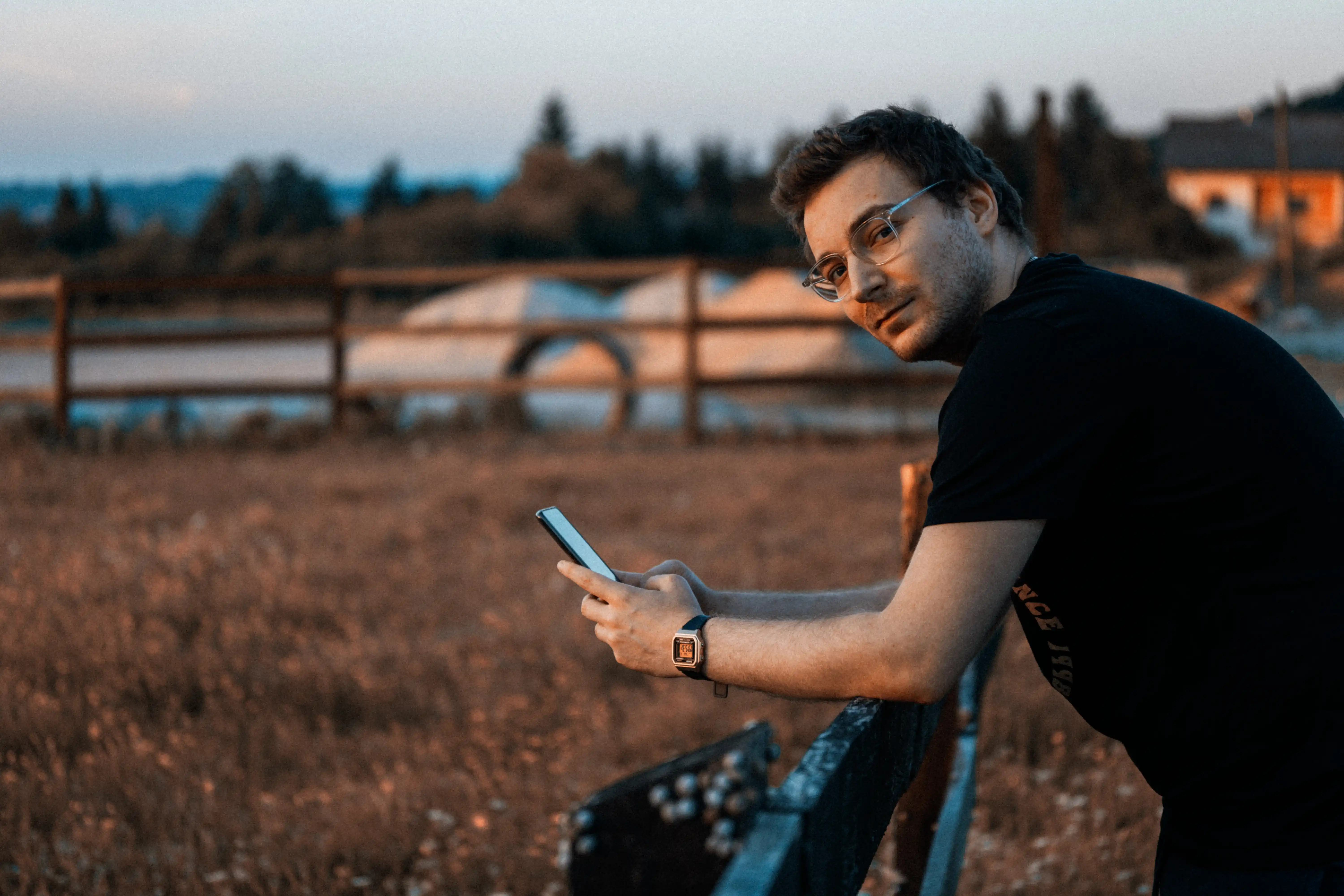 Filip Štefičar Looking At The Camera, Holding His Phone